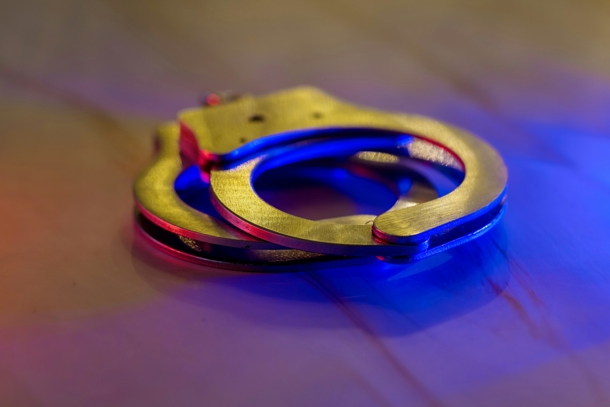 Flashing red and blue police lights of handcuffs police